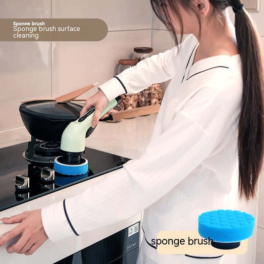 User cleaning stove surface with a dual-purpose handheld sponge brush, showcasing its efficiency in kitchen tasks.